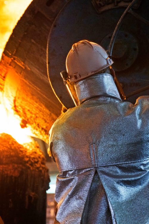 worker-in-protective-clothing-pouring-molten-metal-2025-10-16-23-31-41-utc